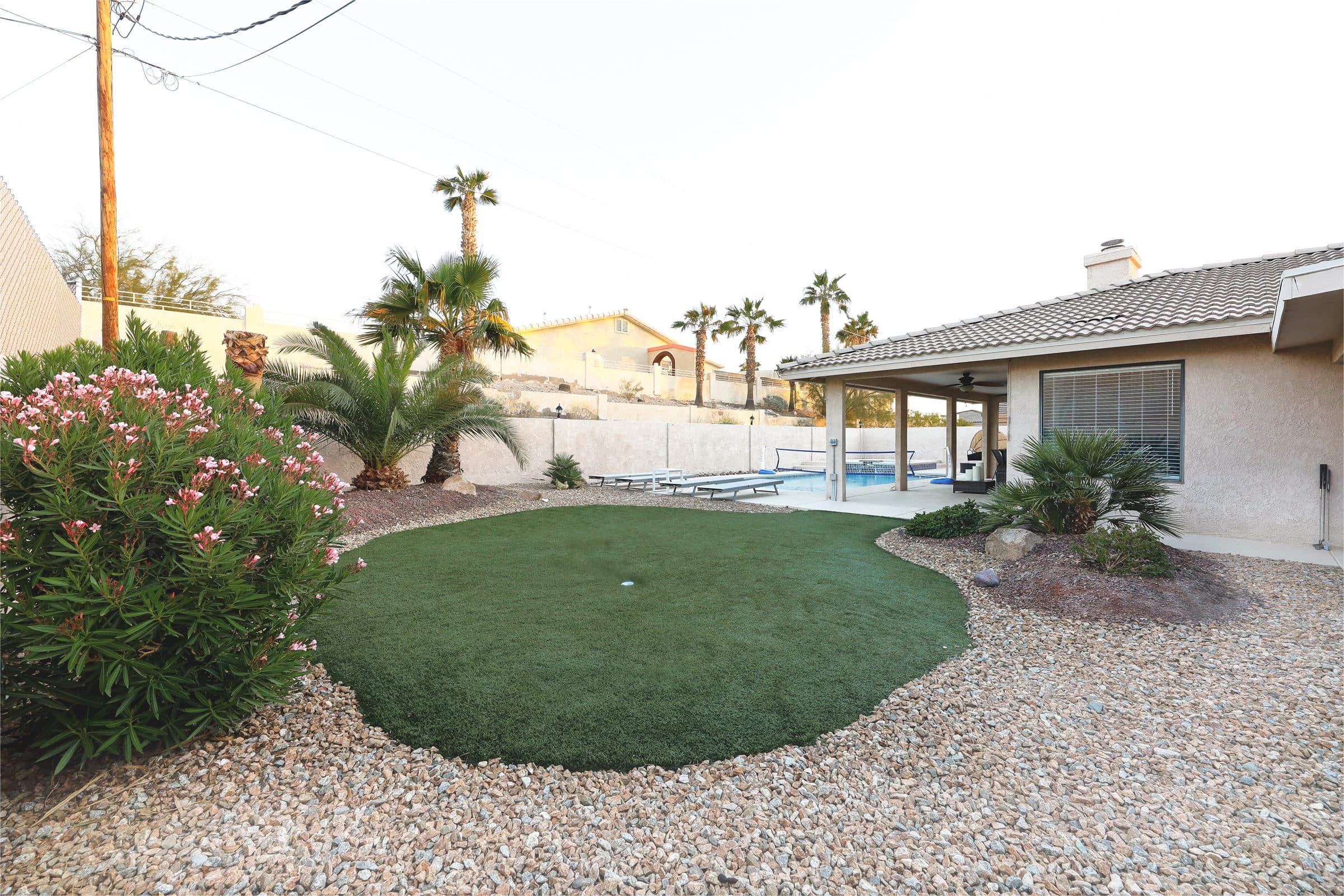 Lake Havasu vacation rental backyard with pool, spa, and lounge space